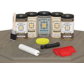 Retique It Driftwood Kit with Liquid Wood, Weathered Wood Gel Stain Alternative, yellow sponge, red graining tool, roller, and brush.