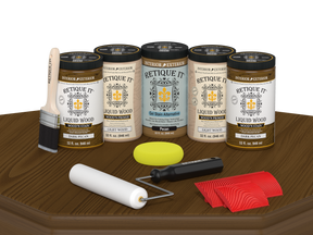 Retique It® Wood'n Cabinet Kit in Dark Pecan stain, includes 24 grained wood cabinet doors displayed on a table.
