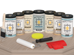 Sun-bleached Wood'n Cabinet Kit by Retique It® with 24 grained doors and matte finish shown on a table.