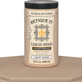 Retique It® Liquid Wood Wood'n Primer in Light Wood, 32 fl oz, showing a table with the primer applied on the surface.