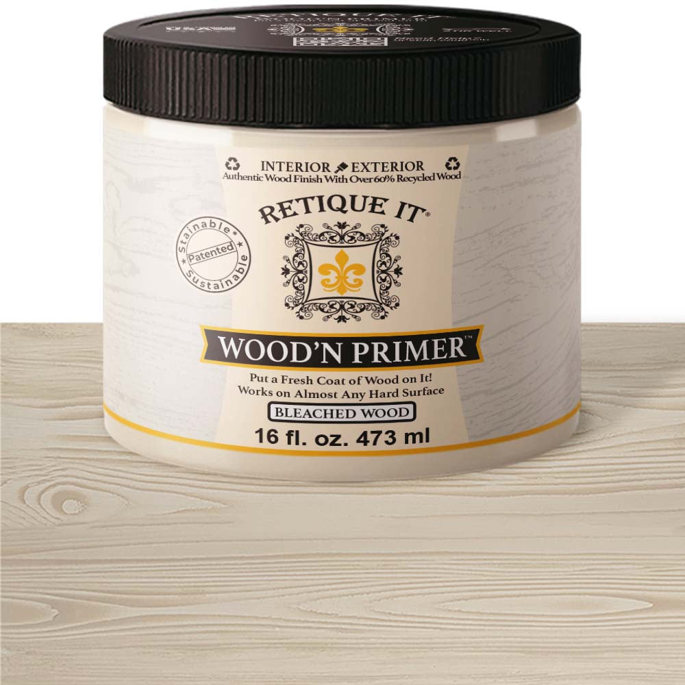 Retique It® Wood Base Primer for wood surfaces, shown in a close-up of the primer-coated wood with applicator tools.