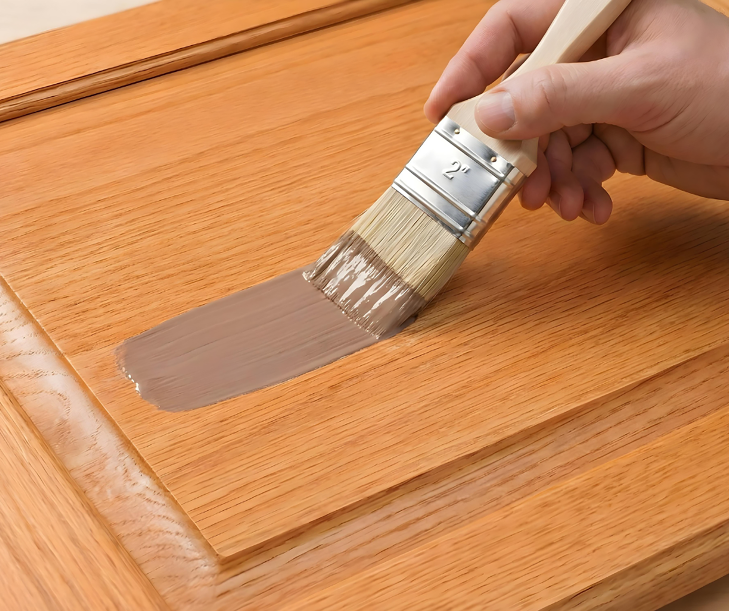 Retique It Universal Liquid Wood Kit in dark wood applying finish to cabinet surface for a natural wood look.