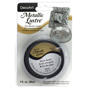 DecoArt Metallic Lustre in Champagne Ice, 1 oz bottle, showcasing its shiny, metallic finish on a smooth surface.