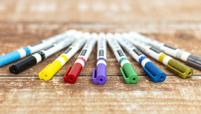 DecoArt glass paint marker set with six colorful markers for decorating glass surfaces and crafts.