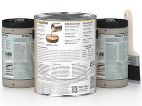 Three cans of paint with labels and a brush on a white background