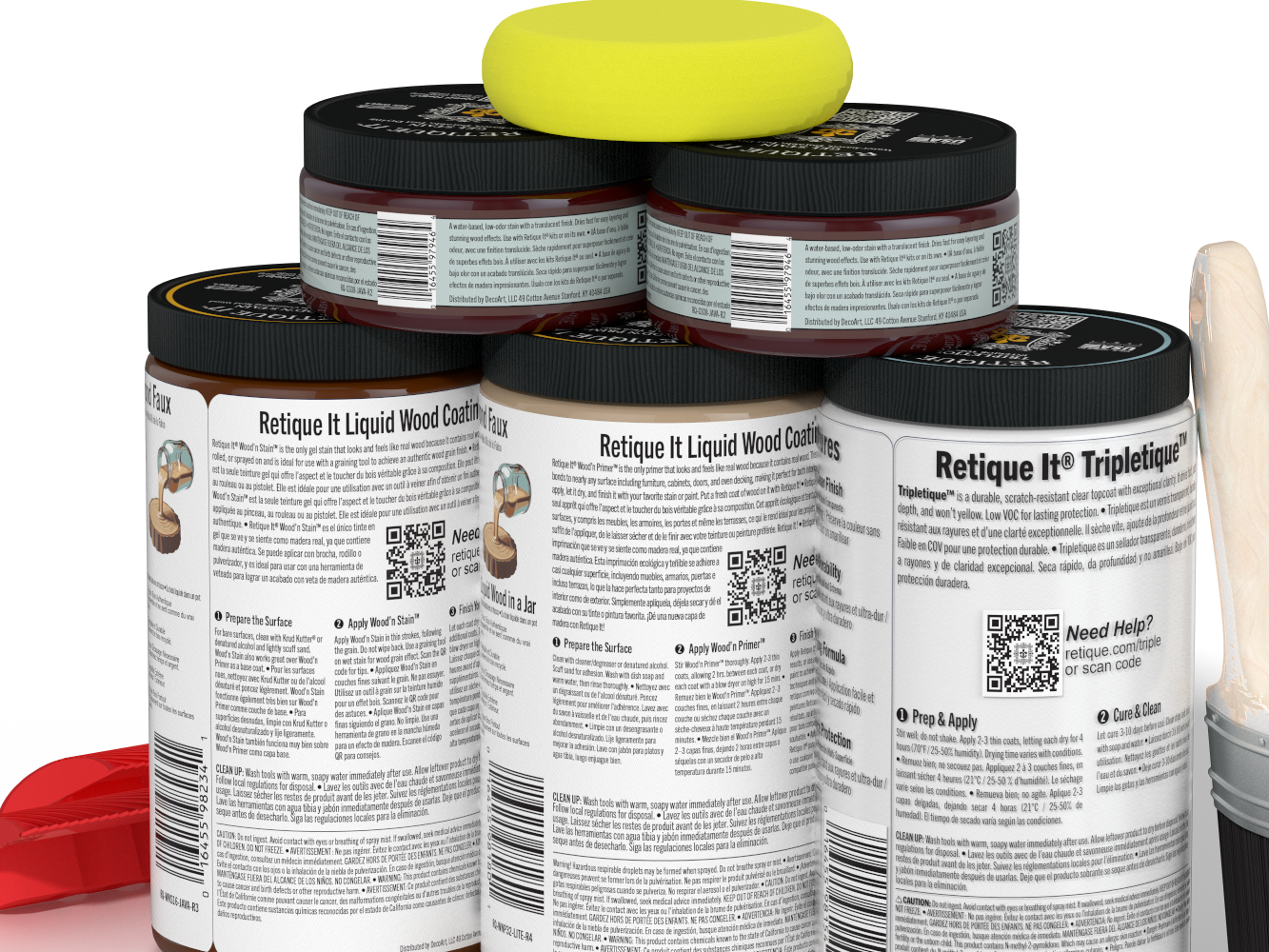 Jars of 'Retique It' liquid wood coating with a yellow sponge on top