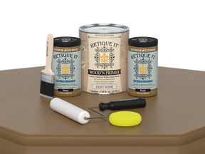 Retique It wood primer set with cans, tools, and packaging on a brown surface.