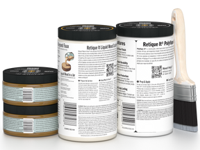 Three jars of a product with labels and a paintbrush on a white background