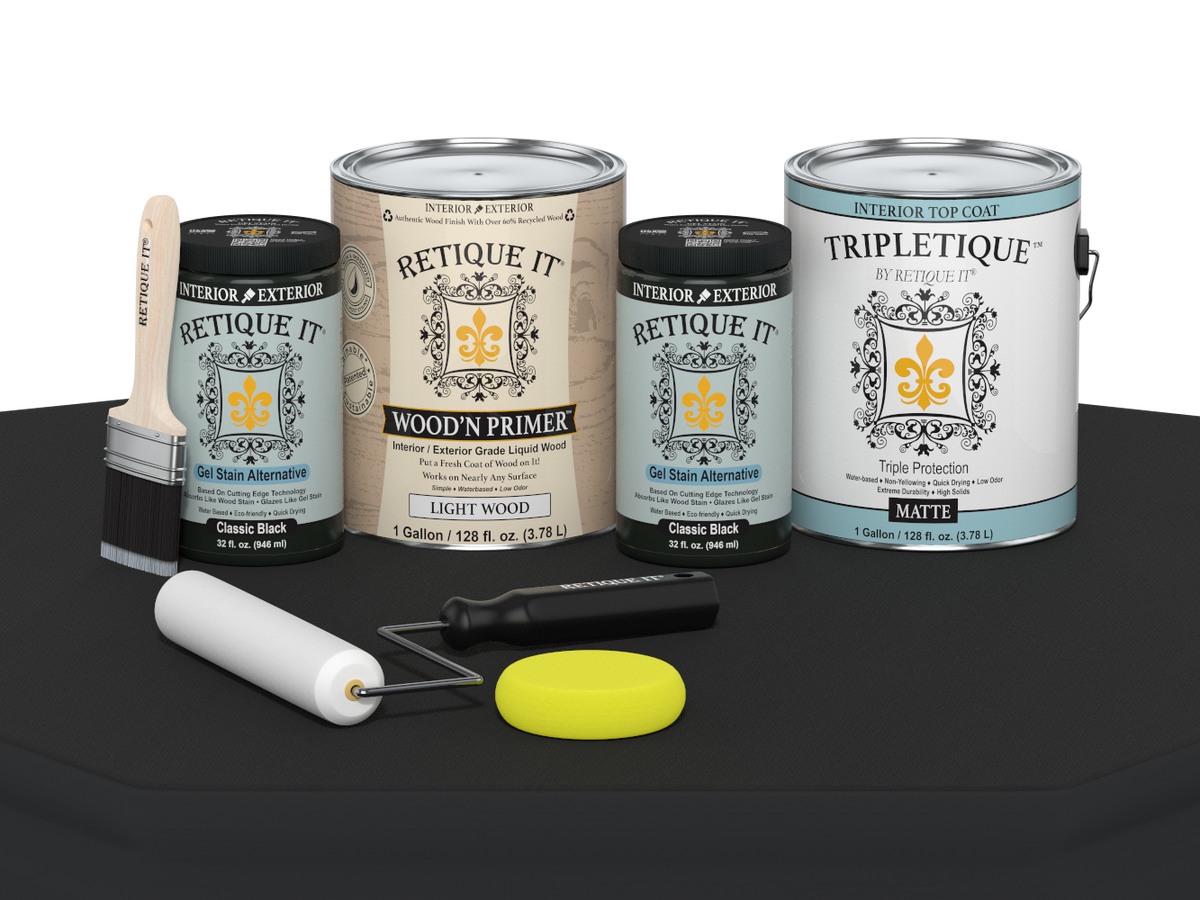 Collection of paint cans and tools on a black surface