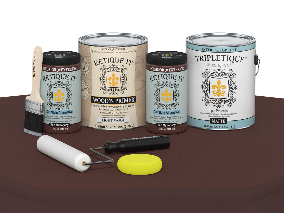 Collection of paint cans and tools on a brown surface