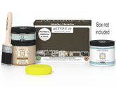 Painting kit with paint, brush, and packaging on a white background