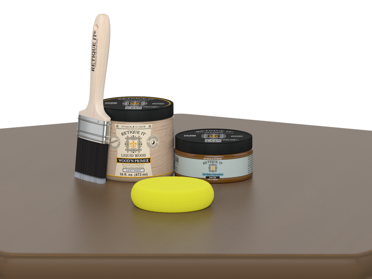 Paintbrush, wooden primer jar, and yellow sponge on a brown surface with a white background