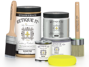 Retique It furniture paint and wax products with brushes and a sponge on a white background
