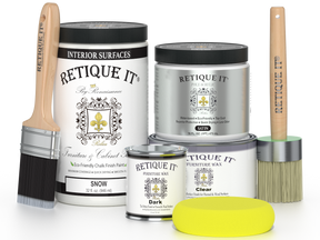 Retique It furniture paint and wax products with brushes and a sponge on a white background