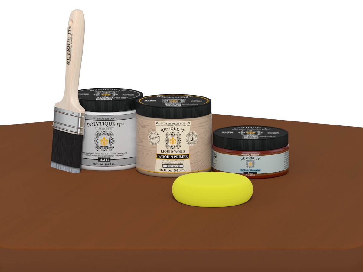 Collection of paint-related products including a brush, jars, and a sponge on a brown surface.