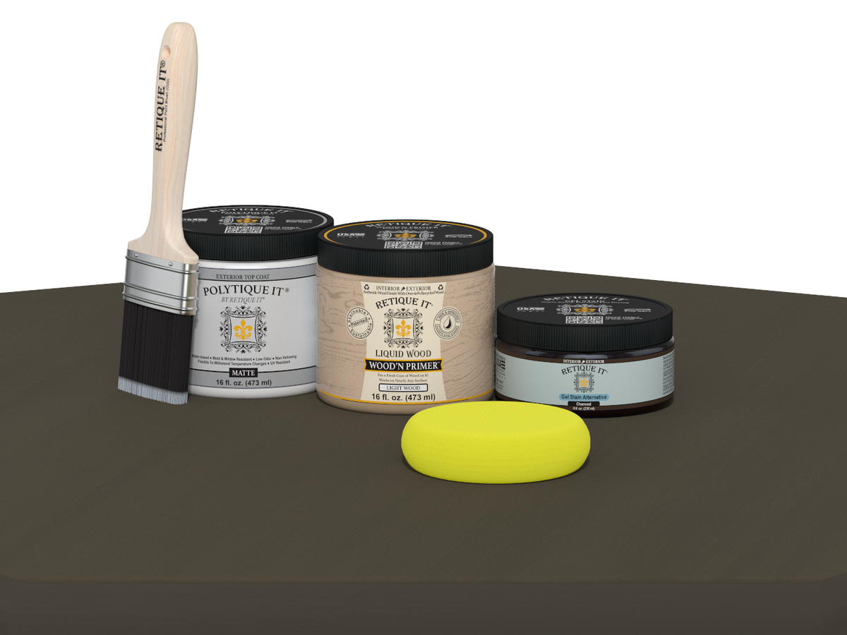 Collection of paint-related products including jars, a brush, and a sponge on a gray surface.