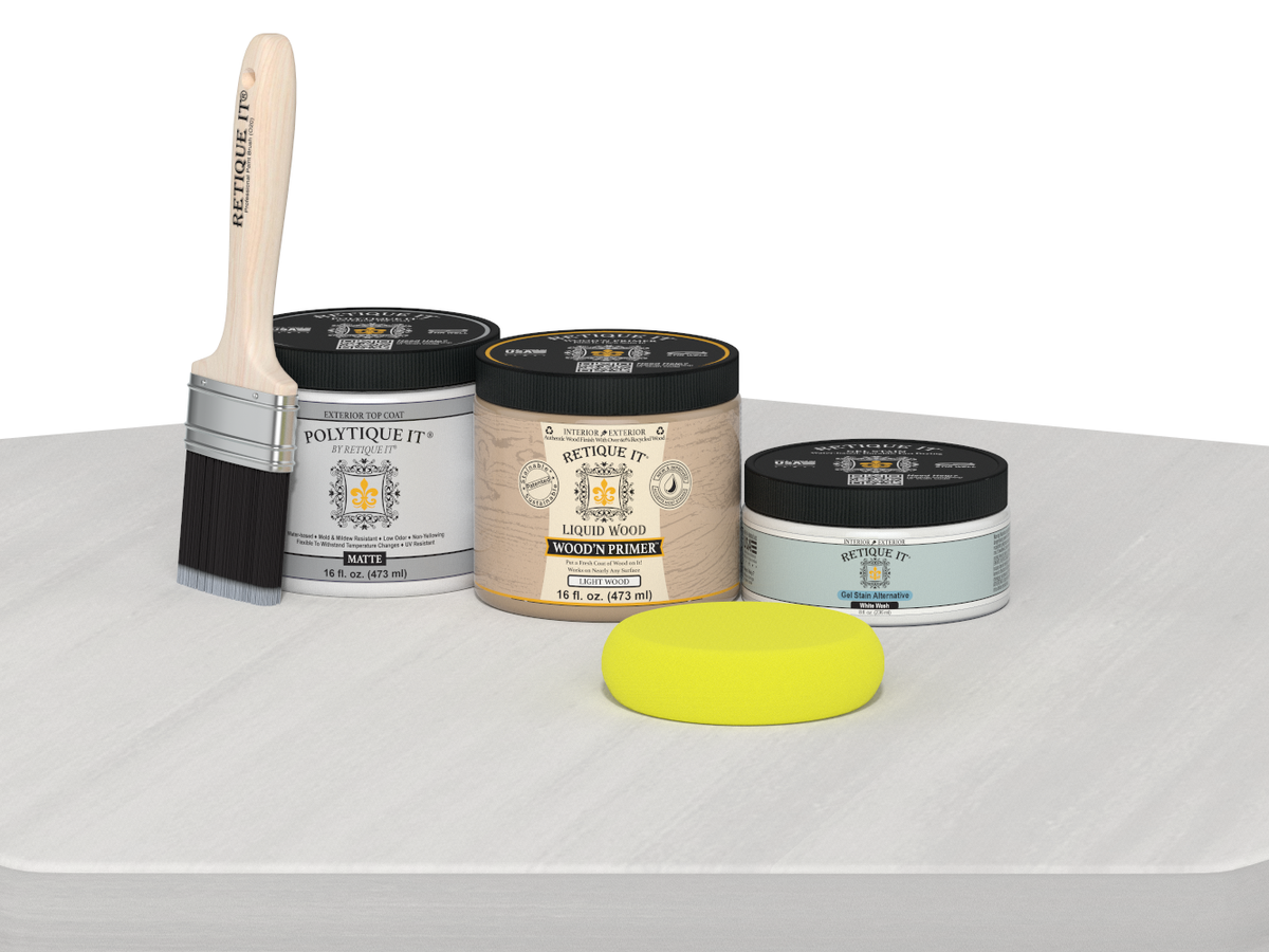 Painting supplies including a brush, cans of paint, and a sponge on a white surface.