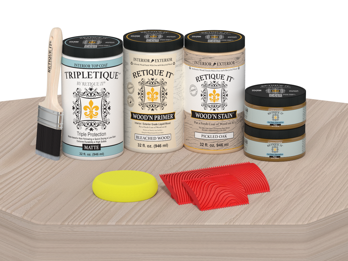 Collection of paint cans and tools on a wooden surface