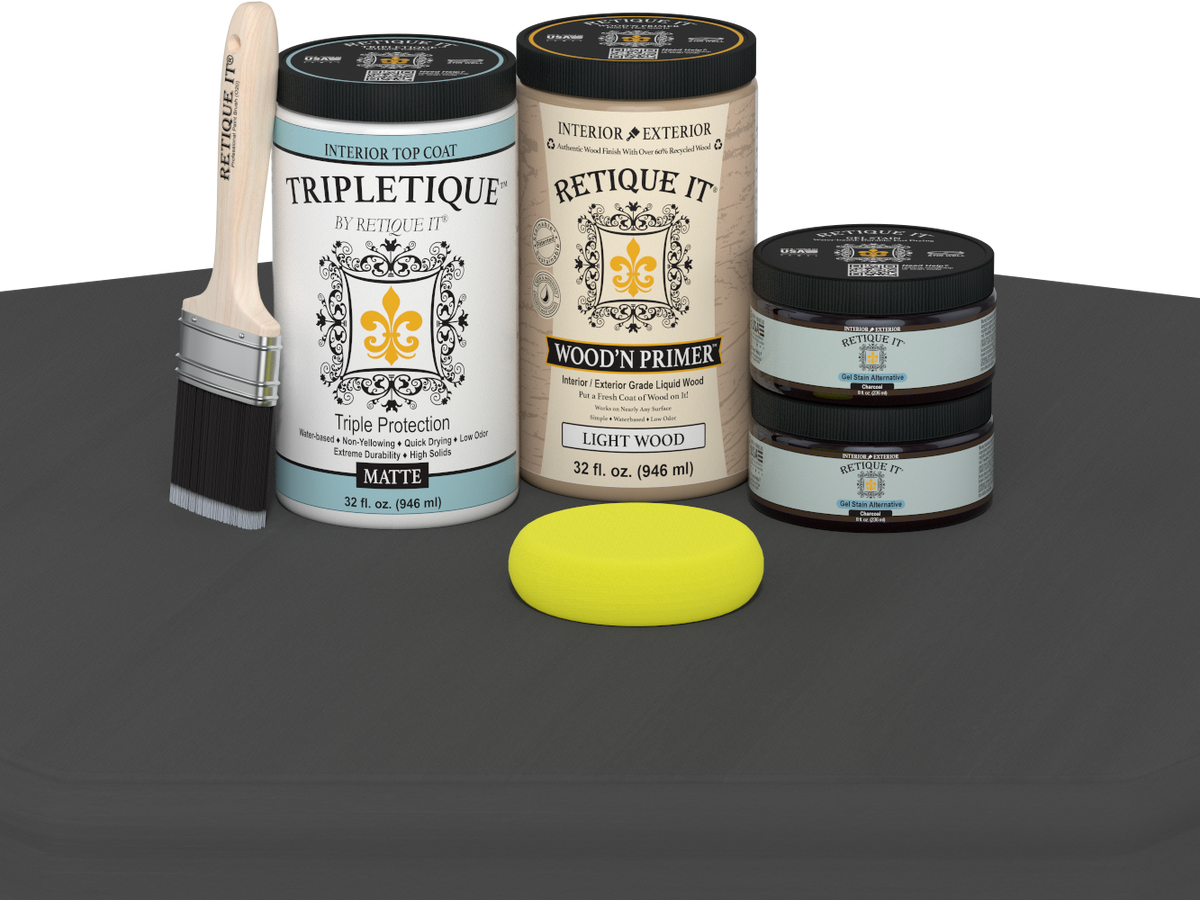 Painting supplies including a paintbrush, cans of paint, and a yellow sponge on a gray surface.