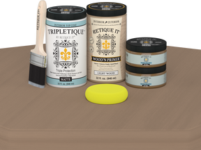 Paint cans and a brush on a brown surface with a white background
