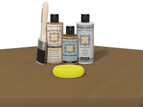Set of Etiketit wood care products including bottles, a brush, and a yellow sponge on a brown surface.