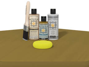 Set of Etiquette Kit products including bottles, a brush, and a sponge on a brown surface.