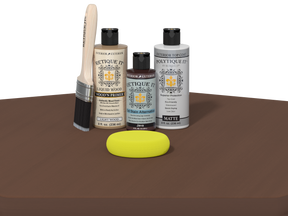 Set of Etiketit paint bottles and tools on a brown surface with a white background